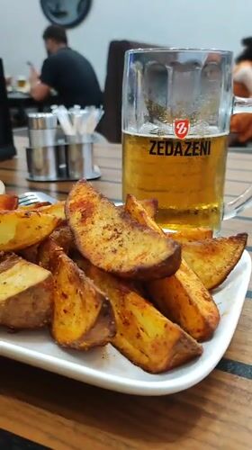 Crispy potato wedges and a cold beer at a Batumi restaurant