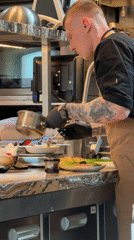 Chef prepares food in Moscow commercial kitchen