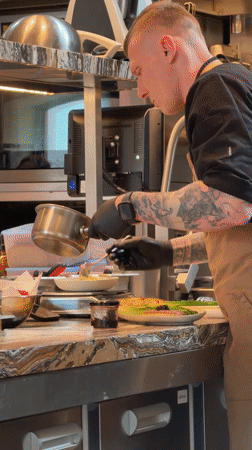 Chef prepares food in Moscow commercial kitchen