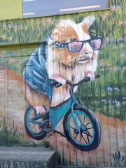 Tallinn street murals featuring anthropomorphic animals in laid-back scenes