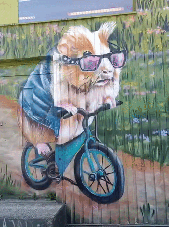 Tallinn street murals featuring anthropomorphic animals in laid-back scenes
