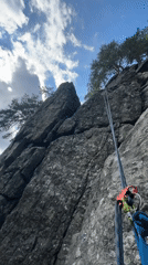 Rock climbing and whitewater streams in dense mountain forest