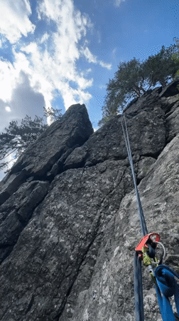 Rock climbing and whitewater streams in dense mountain forest
