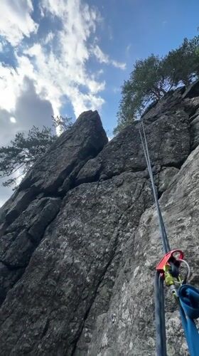 Rock climbing and whitewater streams in dense mountain forest