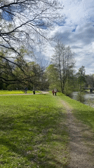 Saint Petersburg park visitors enjoy riverside walk, paddle boating