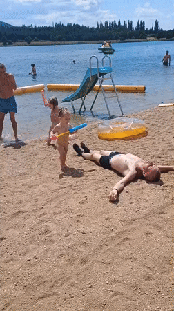 Busy summer day at a lake beach in Sokolov, Czechia