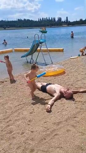 Busy summer day at a lake beach in Sokolov, Czechia