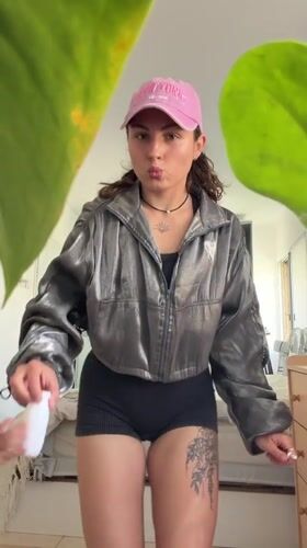 Woman documents morning workout routine in Kiryat Bialik bedroom