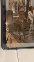Train selfie, sunny canal, and a lone hashtag graphic