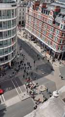 Aerial view captures London street corner pedestrian activity