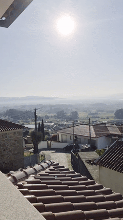 Aerial view captures Portuguese rural landscape with terracotta roofs