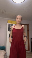 Woman takes mirror selfie in red dress, Russia