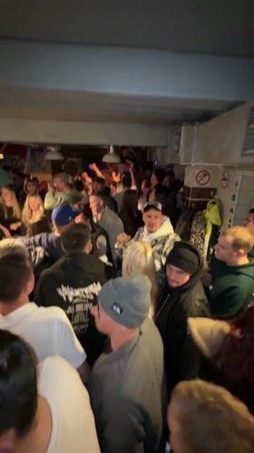 Crowded bar scene captured in Sheregesh, Russia