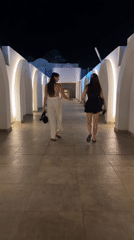 Children's evening stage event at illuminated arched venue in Egypt