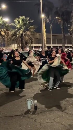 Women perform traditional dance with drums in Arica plaza