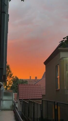 Belgrade neighborhood at golden hour, streets and sky
