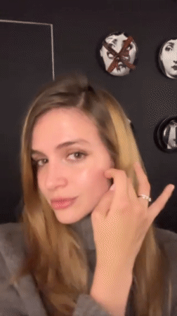 Woman takes selfies in mirror at Tbilisi location