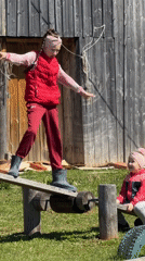 Sisters play badminton and seesaw in Russian backyard
