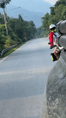 Motorcycle riders travel through Tân Quang Commune, Vietnam