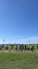 Morning joggers exercise in sunny Kazan park