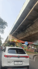 Morning ride through Surabaya's busy streets and decorated overpass