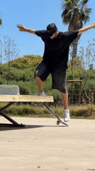 Skateboarder performs ping pong table tricks in Viladecans park