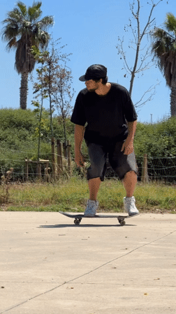 Skateboarder performs ping pong table tricks in Viladecans park