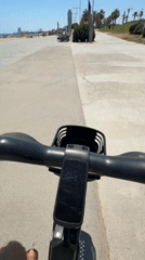 E-scooter cruise along Barcelona's beachfront on a summer afternoon