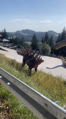 Afternoon walk through an outdoor dinosaur model park