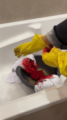 Person removes bloodstained gloves, paints skull in Krasnoyarsk bathroom