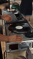DJ performs with turntables and mixer in Kiel
