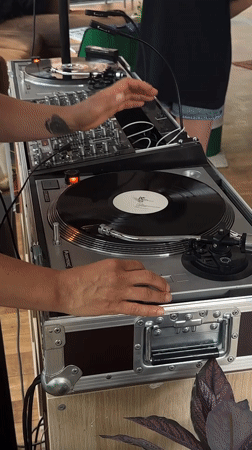 DJ performs with turntables and mixer in Kiel
