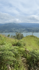 Hiker documents scenic lake views in Kintamani, Indonesia