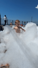 Kids and adults enjoy a sunny Sochi waterfront morning