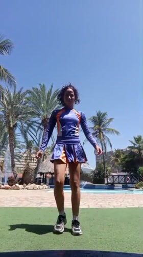 Woman performs poolside activities, dances in Porlamar Venezuela