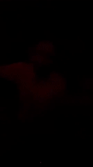 DJ performs under red lights at Tel Aviv venue