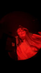 Woman dances under red lights in Belgrade, hashtag trending