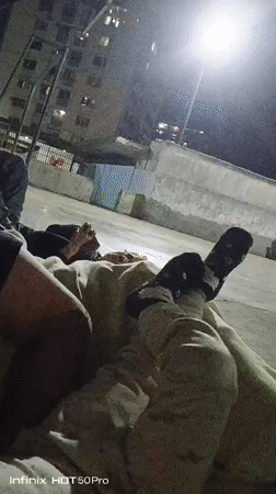 Late-night gathering on a Caracas basketball court