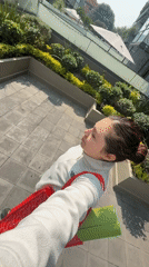 Woman with yoga mat walks through Mexico City
