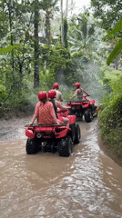ATV group rides through muddy jungle trails in Payangan