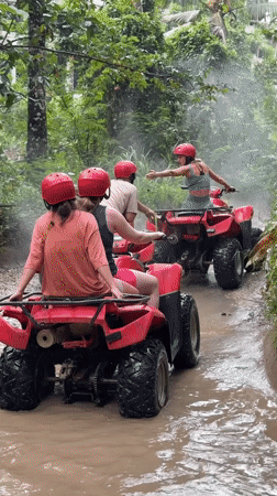 ATV group rides through muddy jungle trails in Payangan
