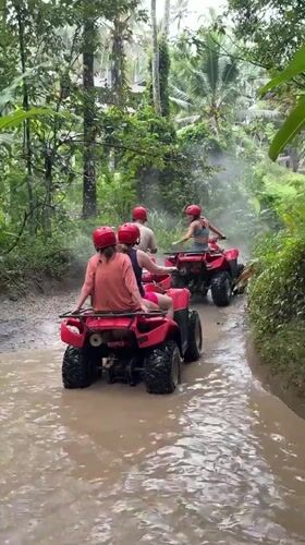 ATV group rides through muddy jungle trails in Payangan