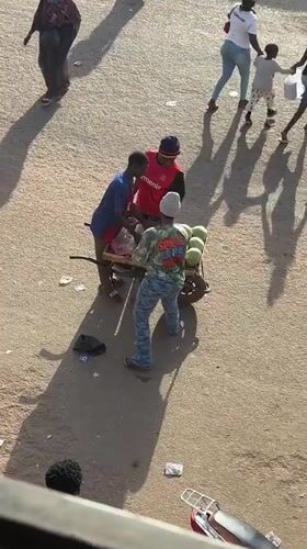 Daily street commerce and minor accident documented in Bukuru