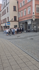 Traditional Bavarian gathering on Ingolstadt cobblestone street