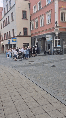 Traditional Bavarian gathering on Ingolstadt cobblestone street
