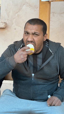 Man eating snack observed in Hirevo, Bulgaria
