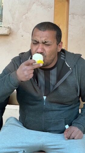 Man eating snack observed in Hirevo, Bulgaria