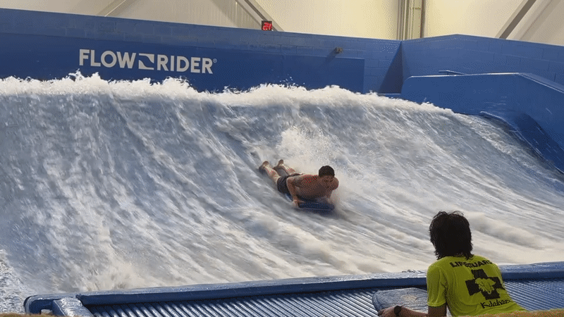 Late-night bodyboarding session at Lake Delton surf simulator