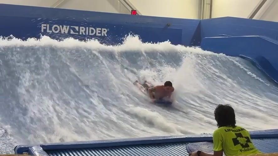 Late-night bodyboarding session at Lake Delton surf simulator