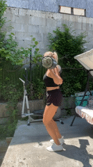 Woman performs outdoor fitness routine in Baranovka, Russia